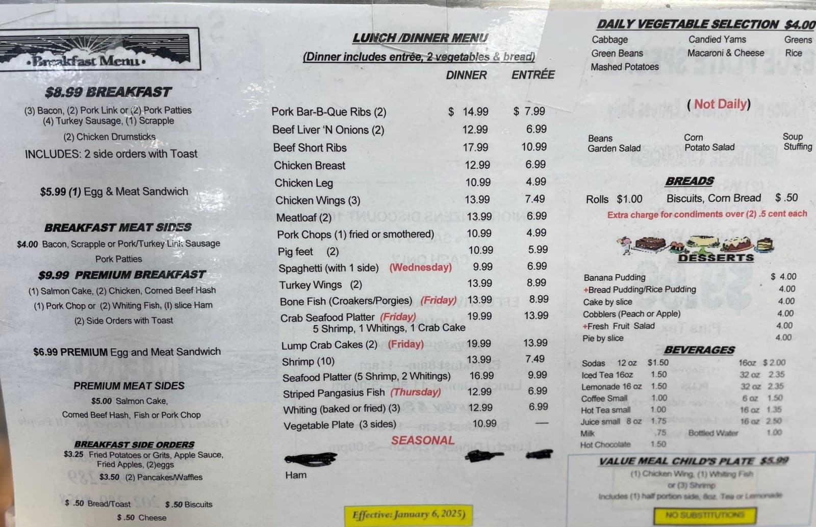 The printed menu board at Saint's Paradise Cafeteria